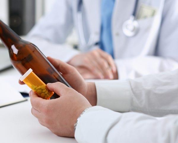 All About Private Alcohol Detox Alcoholic Holding Empty Bottle